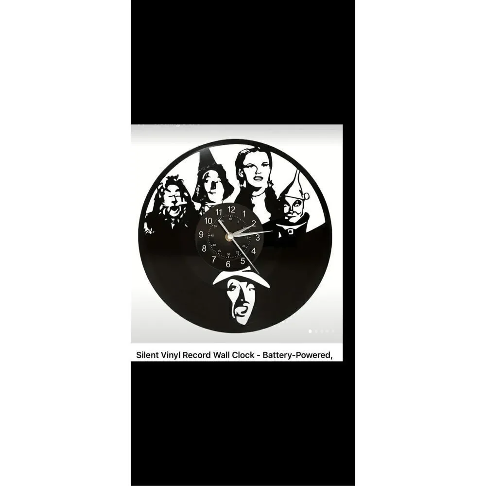 Wizard of Oz black metal clock aprox 12” in diameter